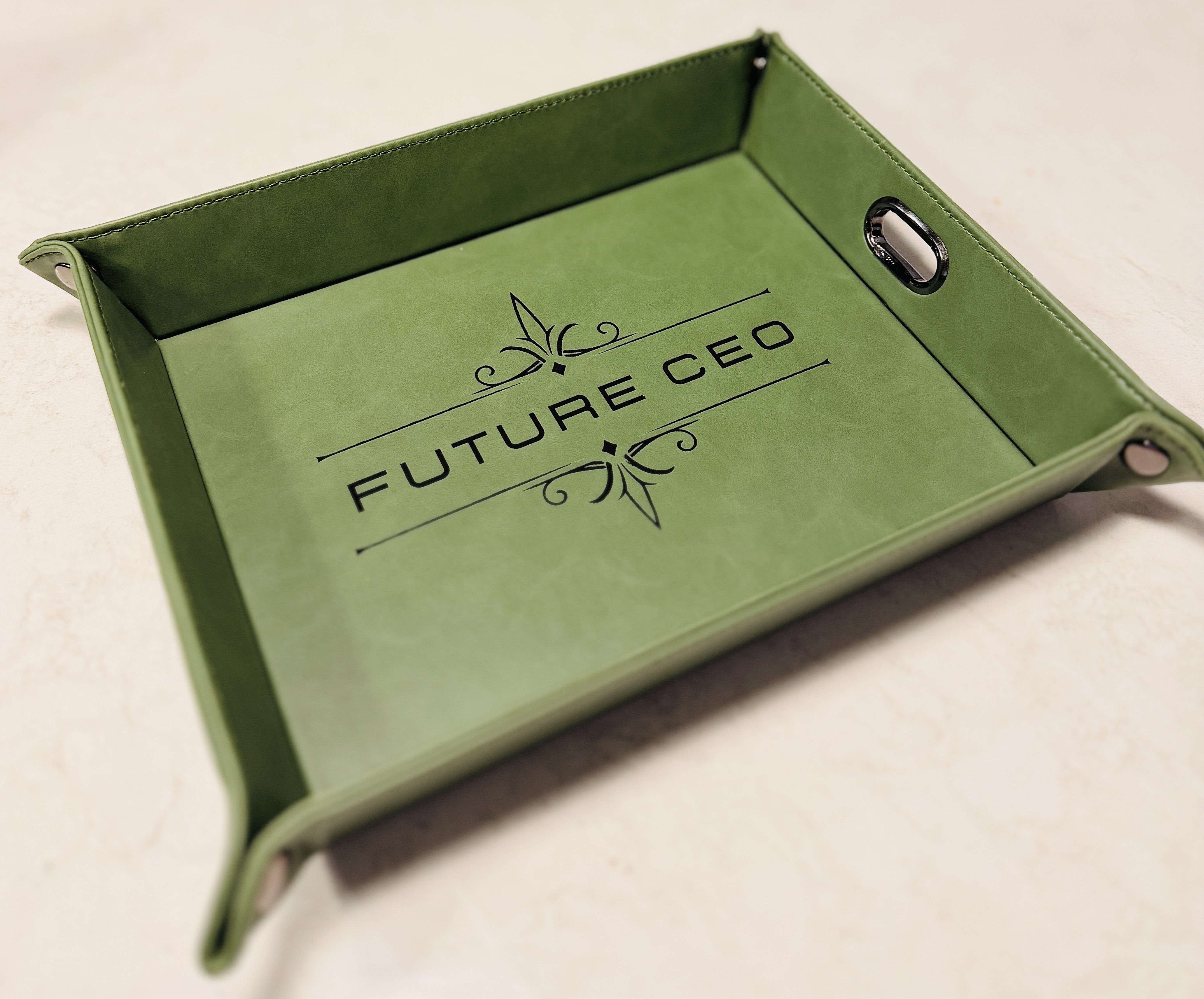 Green leatherette valet tray engraved with "Future CEO."